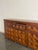 Architectural gravity meets robust texture in this 1960s Spanish Brutalist sideboard. Deeply carved geometric facades and...