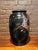 Antique Japanese high-relief lacquer baluster vase measuring 16 inches tall with an 8-inch mouth diameter. Features a...