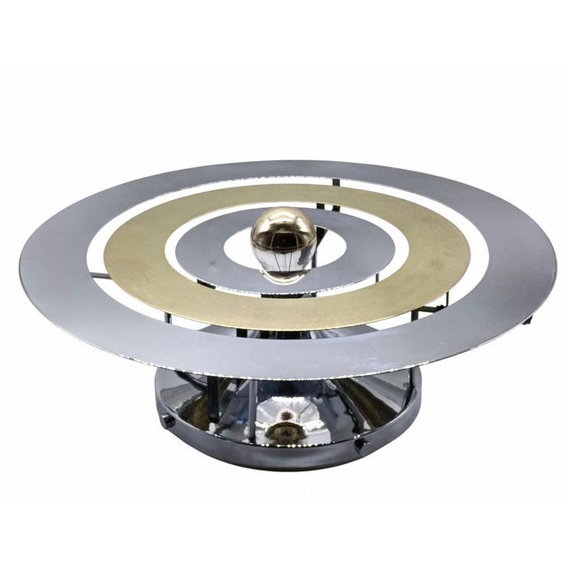 Particular Spage Age wall lamp from the 70s with a circular shape in polished chrome metal and brass. Wear consistent with...