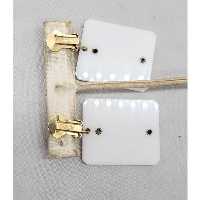 Vintage 1970s Signed Napier Goldtone Asian Character White Resin Pendant Clip Earrings- 2 Pieces For Sale - Image 9 of 9