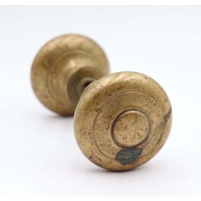 Vintage concentric passage door knobs made of brass with a patina finish. Priced as a pair of knobs with a spindle. Good...