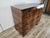 An elegant vintage Art Deco dresser dating back to the 1940s, crafted from walnut burl and featuring a refined grain...