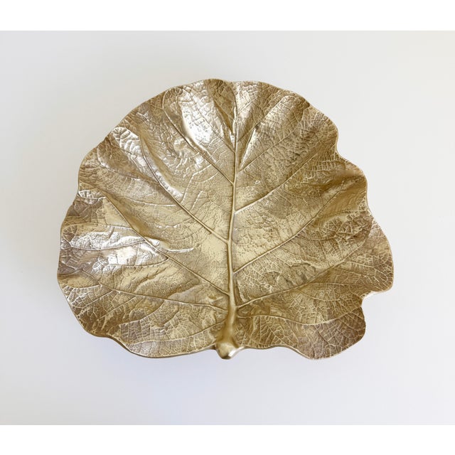 A gold anodized aluminum alloy sea grape leaf decorative dish, bowl, or centerpiece, handcrafted by Virginia...