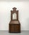 An elegant vintage Georgian-style secretary cabinet crafted in a warm walnut finish with a graceful bonnet crown and...