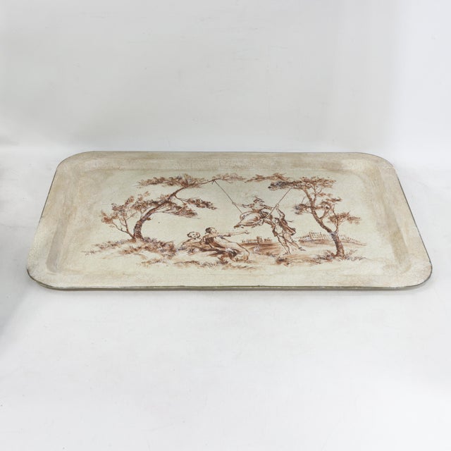 This elegant vintage rectangular tole tray features a romantic, hand-painted Rococo-style scene rendered in a...