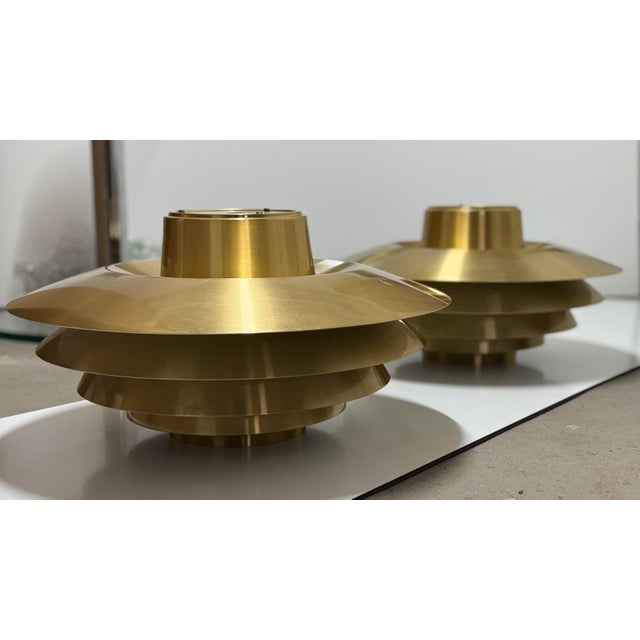 A beautiful pair of rare vintage veronas in brass and white. This impressive light with five reflectors was designed by...