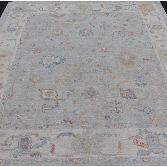 Measures: 8'3 x10'0 Modern All-Over Floral Oushak with a Light Gray Background With Delicate Accents. Keivan Woven Arts:...