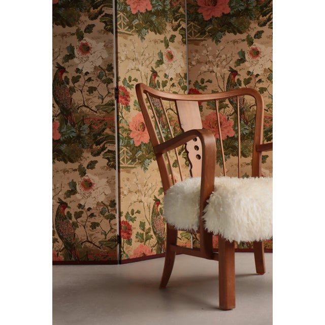 Striking vintage three-panel room divider featuring a richly patterned printed fabric depicting exotic birds perched among...