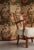 Striking vintage three-panel room divider featuring a richly patterned printed fabric depicting exotic birds perched among...