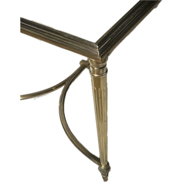 This timeless Art Deco coffee table makes a sophisticated statement in any living space. Measuring 41" by 21" by 17" high,...