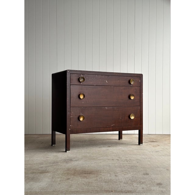 Vintage Art Deco three-drawer steel chest by Norman Bel Geddes, defined by its architectural frame, rounded edges, and...