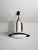 This elegant italian ceiling lamp from the 1960s is a stunning example of mid-century modern design. The centerpiece is a...