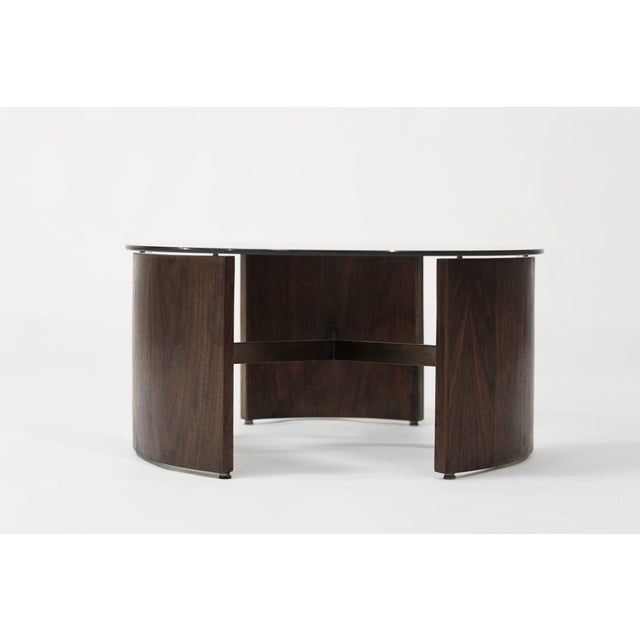 restored vintage Vladimir Kagan Radius Table is redone in our dark walnut finish, featuring the signature nickel stretcher...