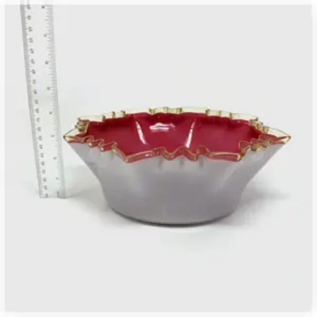 This Victorian glass brides basket bowl has a pink interior cased in white with a uranium glass crimped rim that glows...