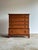 Warm brown tones carry across this five-drawer dresser chest, shifting from honey to deep tobacco as the light moves over...
