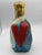 Vintage handmade Haitian voodoo spirit bottle. Gorgeous colors in various patterns that change as you turn the bottle. The...