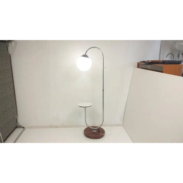 - height-adjustable and rotatable chrome-plated metal construction, wooden veneered base, walnut veneer, new shellac...