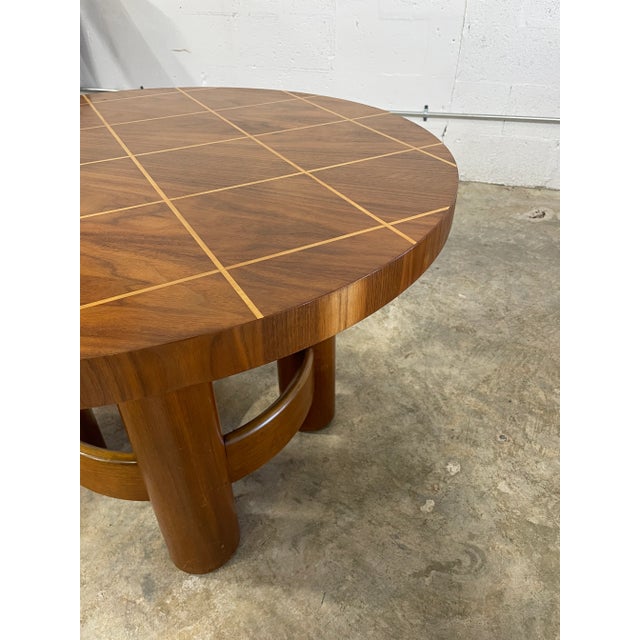 Stunning Round Coffee Table by Reiners. Made in Mjölby, Sweden, 1950s. Geometric inlay on the top and thick round legs....
