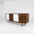 Italian sideboard from the 1970s. Teak frame with a hinged, white-plated door on the left, a teak chest of drawers on the...