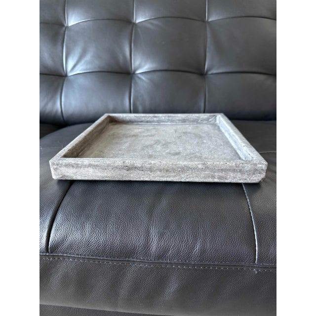Handcrafted stone tray by Cyan Design, made in India. Square form with a substantial raised rim and beautifully weathered,...