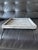 Handcrafted stone tray by Cyan Design, made in India. Square form with a substantial raised rim and beautifully weathered,...