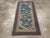This early 20th century Chinese Peking Art Deco rug, presents a captivating pastoral scene woven with charm and artistry....
