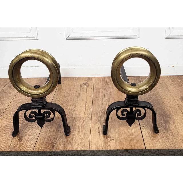 Pair of Italian brass andirons, having the usual back in wrought-iron pillars with the beautiful circle shaped brass decor...