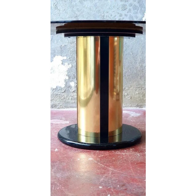 Round table dating back to the 60s in the style of Antonia Astori. Splendid amber temperate glass top. Very heavy...