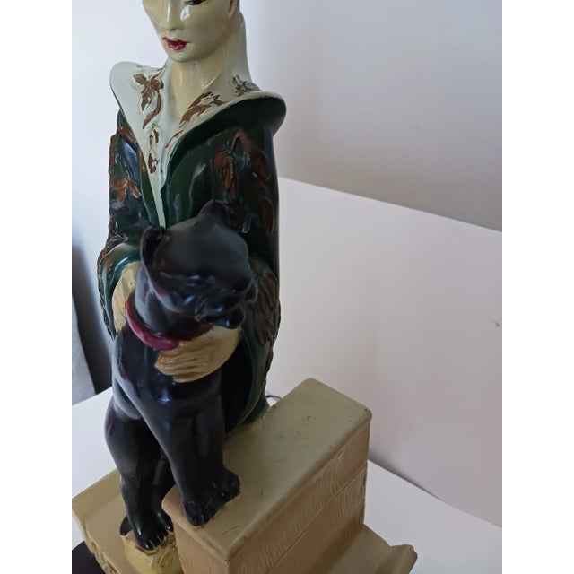 Elegant chalkware lamp and original fabric shade. Dated 1950 and signed Continental Art Co. 18" to finial 27" with shade...