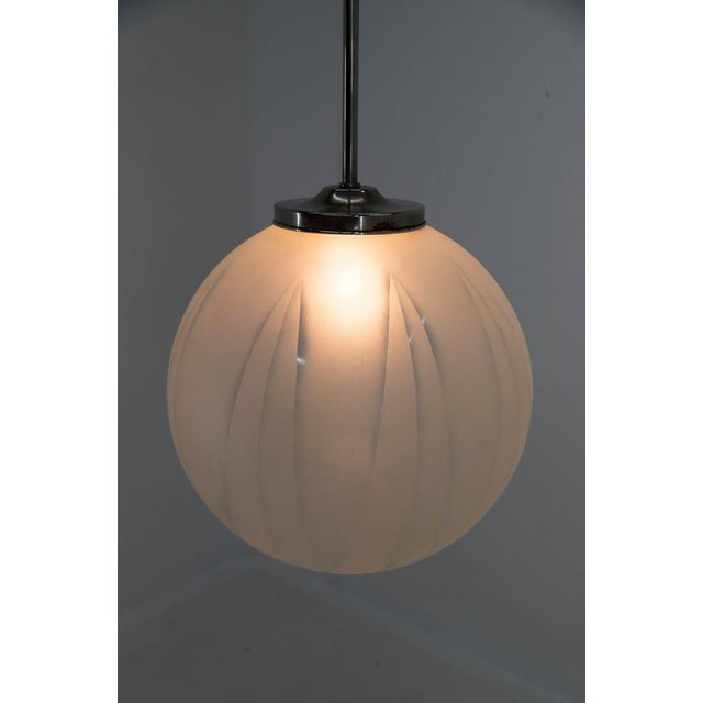 Huge glass Art Deco pendant with sandblasted geometrical pattern. Made in Europe in 1930s Long nickel rod polished, can be...