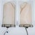 Pair of resin faux marble demilune wall sconces.