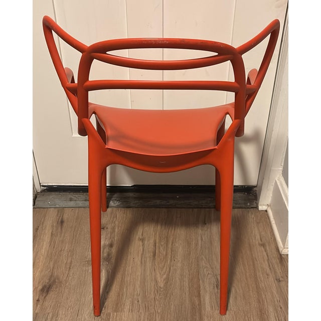 Kartell Masters Arm Chair by Philippe Starck and Eugeni Quitllet- Orange Whimsical, fluid design on this sculptural arm...