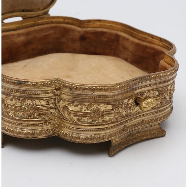 This refined and highly decorative 19th Century French jewelry box is an exquisite example of luxury decorative bronze...