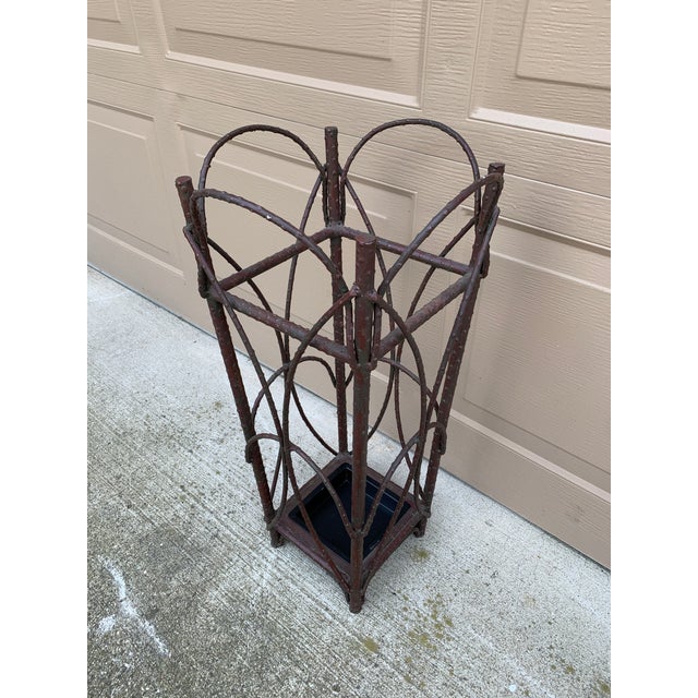 A gorgeous rustic trompe l'oeil faux twig iron umbrella or cane stand, ideal for your cabin, mountain home, or cottage....