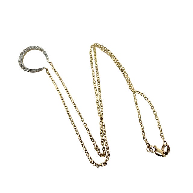 This elegant Victorian 14K gold horseshoe pendant necklace showcases 21 rose‑cut diamonds arranged in a classic crescent...