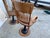 This set of 3 antique oak juror chairs from the early 1900s features a cast iron base and a brown varnished finish. Fully...