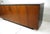 A rare exceptionally stunning mahogany credenza or sideboard with double tri folding doors having thin black pulls. The...