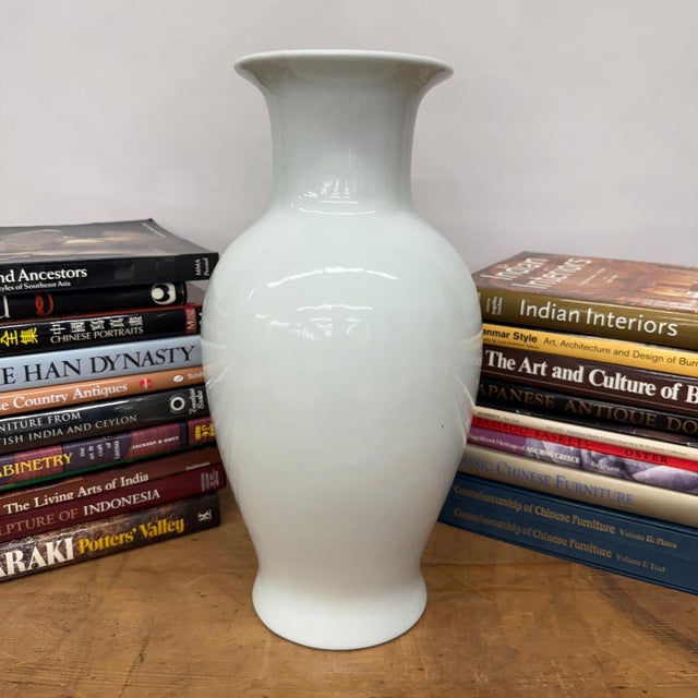 "About This Piece About This Piece Bring home a timeless expression of elegance with this white glazed ceramic vase,...