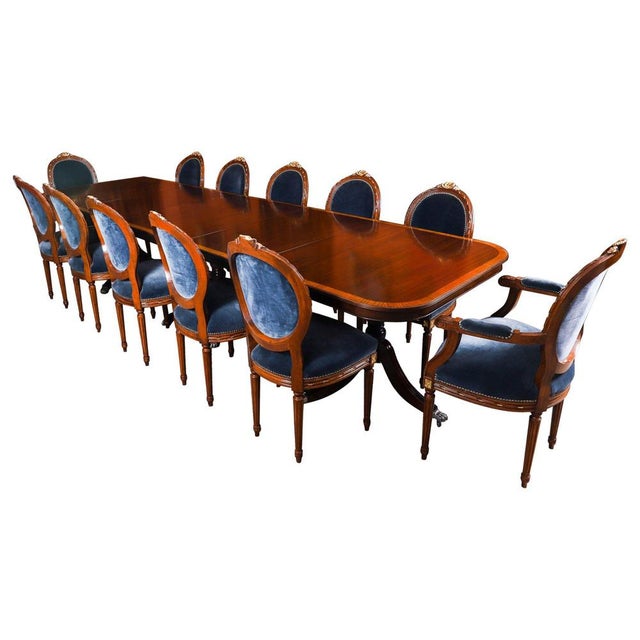 This is a superb dining set comprising a 12ft Vintage Regency Revival dining table with a striking set of twelve Louis...