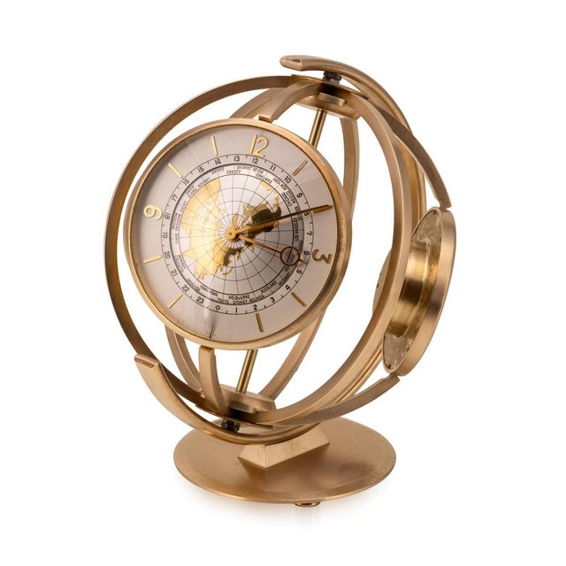 Vintage 20th Century gilded rotating desk compendium, incorporating a world time clock, thermometer and aneroid barometer....