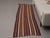 Vintage Hand-Knotted runner rug is a semi-antique vintage area rug. The '70s Eastern region of Anatolia's unique rug is...