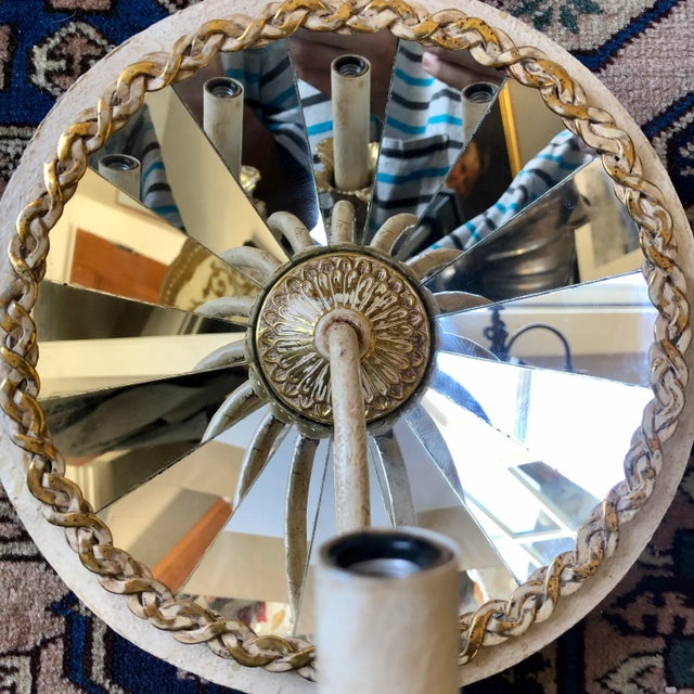 Vintage round faceted mirror sconce.