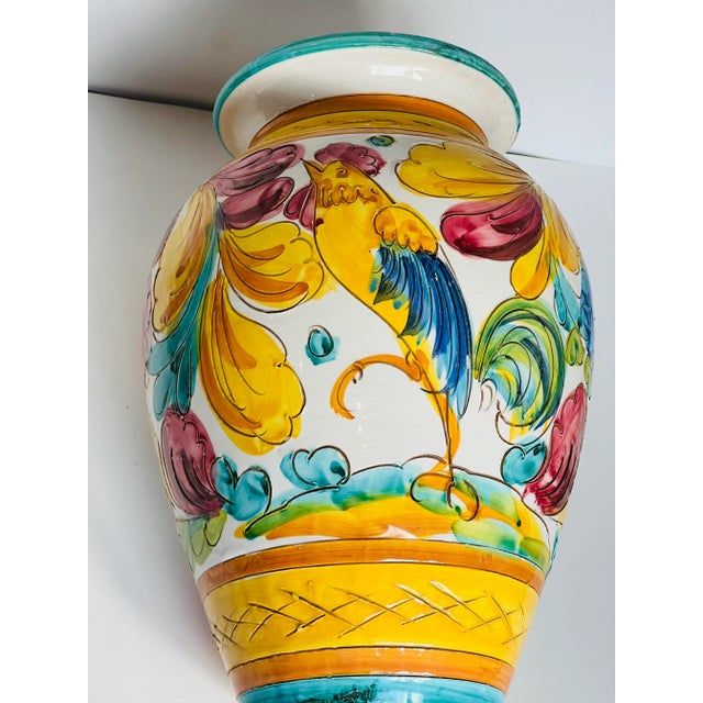 Vintaage sgradito majoilica vase with beautiful happy colors and a large rooster and smaller bird on the the other side....