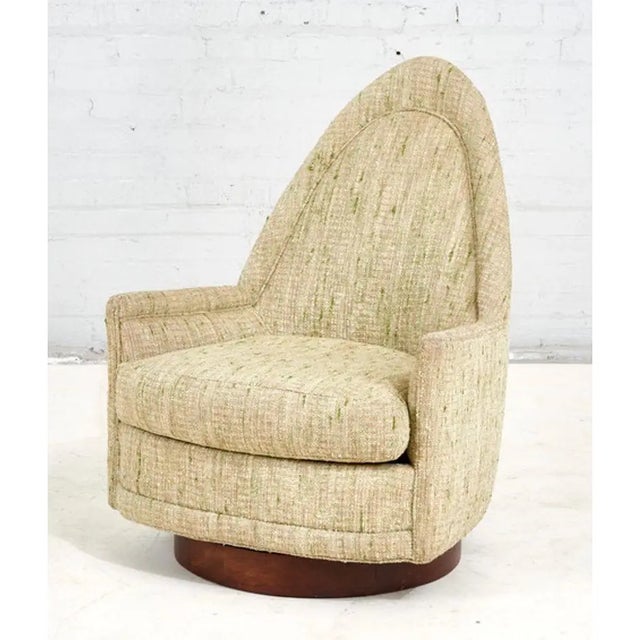 Selig Swivel Lounge Chair, 1960. Original upholstery with walnut plinth base.