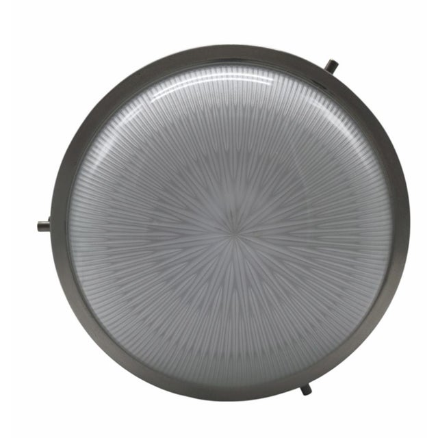 Wall/ceiling lamp Mod. Sigma designed by Sergio Mazza for Artemide. Nickel-plated brass frame and pressed opaline glass....