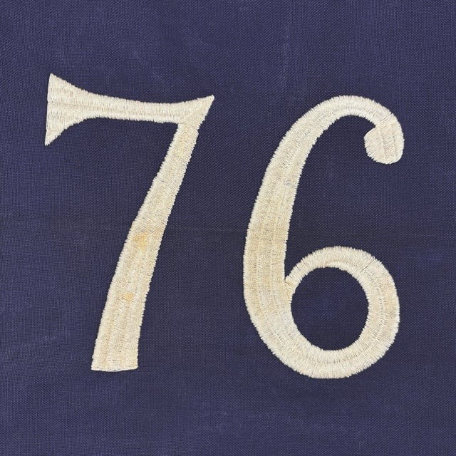 This vintage American Bennington flag is made from a cotton cloth, with sewn stripes and fully embroidered emblem. Please...