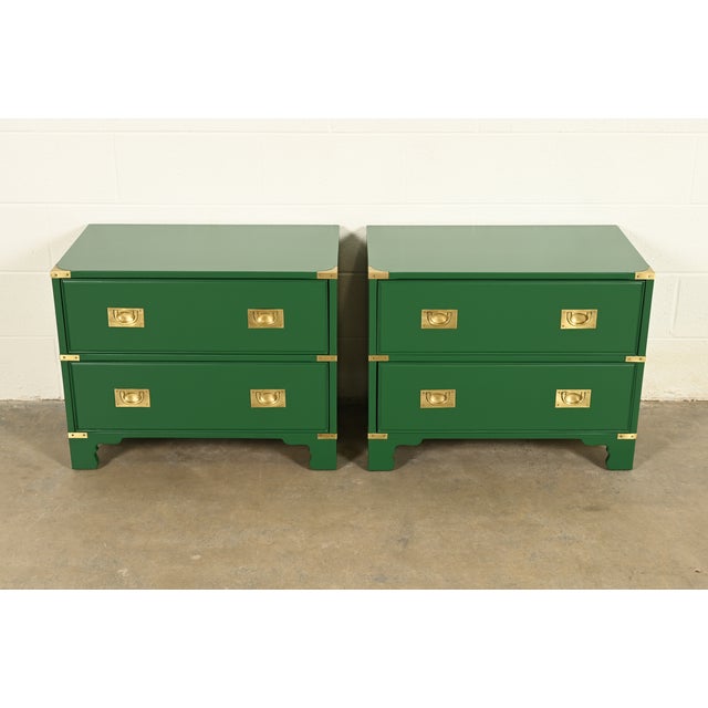 A gorgeous pair of mid-century modern Hollywood Regency Campaign style nightstands By Drexel Heritage USA, Circa 1970s...