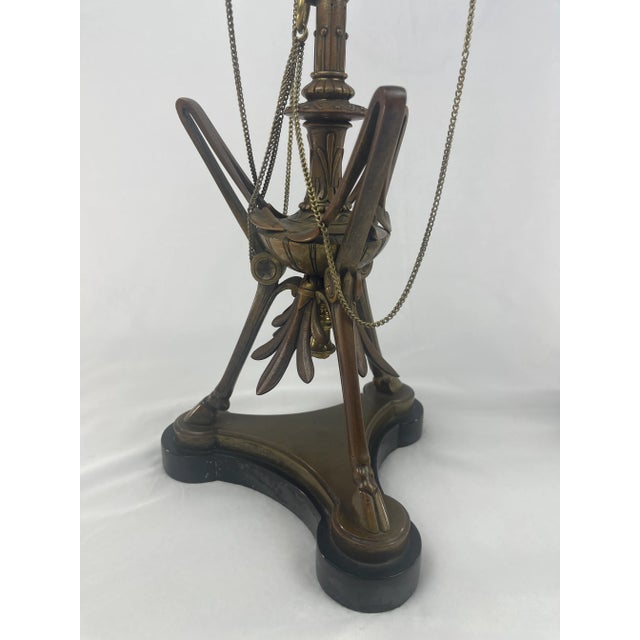 An exceptional pair of late 19th-century French bronze candelabras cast by the renowned Ferdinand Barbedienne Foundry,...