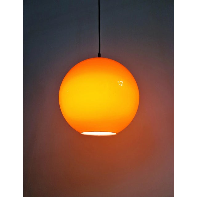 Round orange opaline pendant lamp, produced by the manufacturer lita in the 1970s. --> 1 pendant lamp still available....