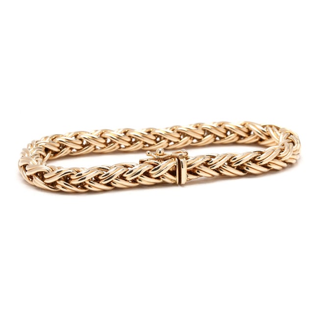 Circumference: 7.38 inches Width: 6.8 mm Weight: 13.6 dwts. / 21.1 grams Stamps "585 Tiffany & Co" SKU: B1291 A Couple Of...